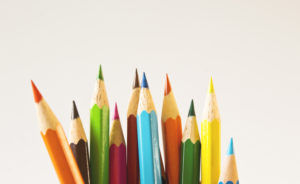 Colored pencils on a white background.