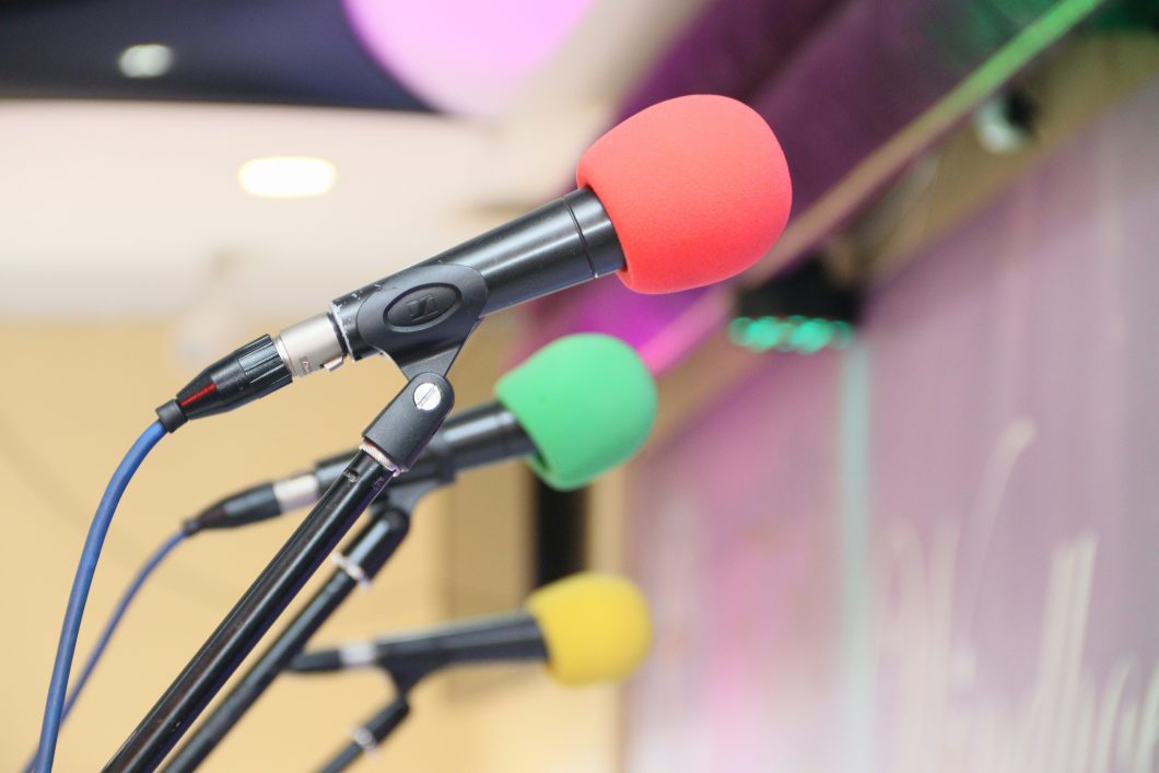 A bank of colorful microphones.