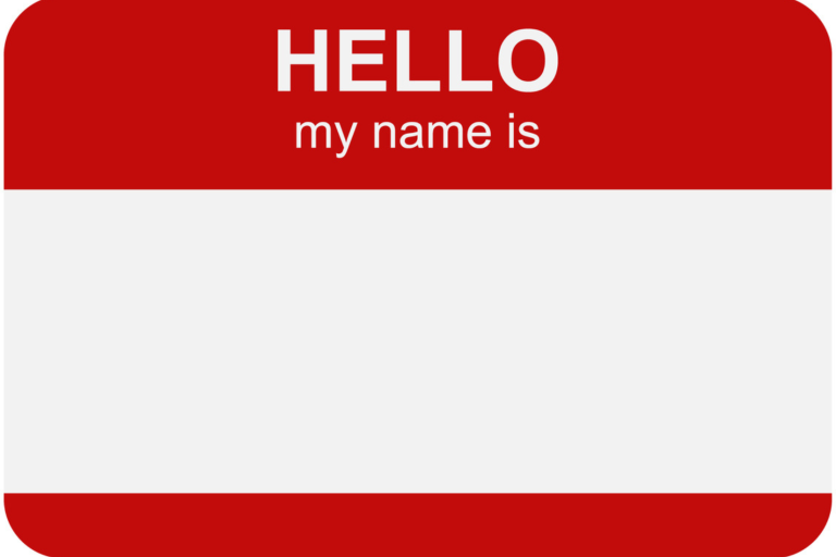 A red and white sticker that says "HELLO my name is," followed by a blank spot.