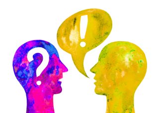 An illustration of two heads. The yellow and green one on the right has a speech bubble containing an exclamation mark coming out of it's mouth. The pink and blue head on the left has a question mark inside. 