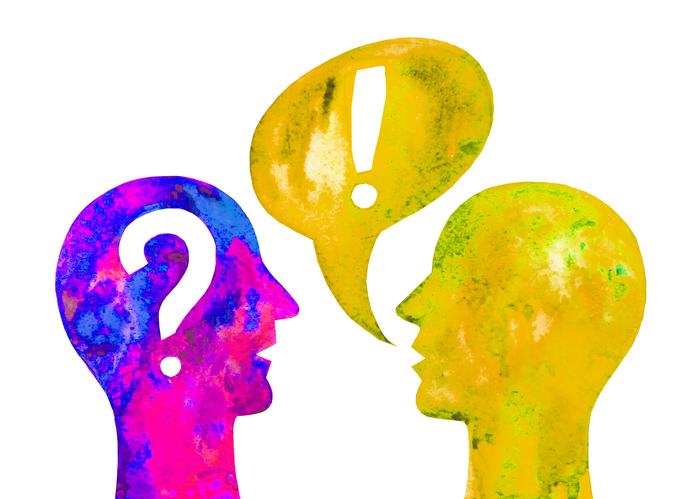 An illustration of two heads. The yellow and green one on the right has a speech bubble containing an exclamation mark coming out of it's mouth. The pink and blue head on the left has a question mark inside.