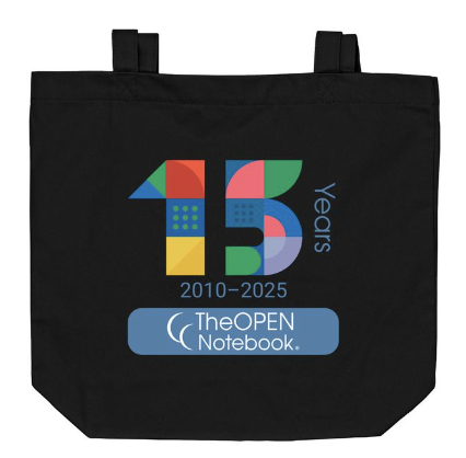 Black tote bag with The Open Notebook's 15th anniversary logo.