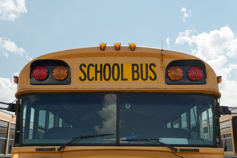 The front of a yellow school bus